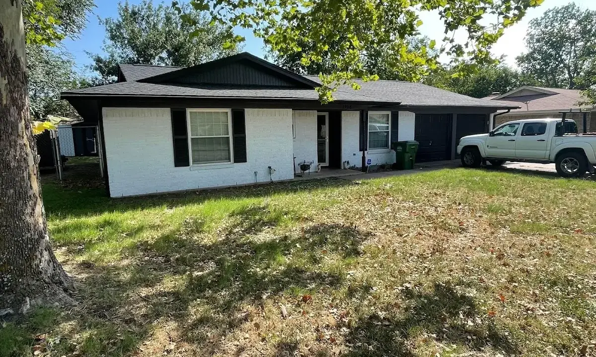 Professional roofing crew working on a residential roof in Mantua